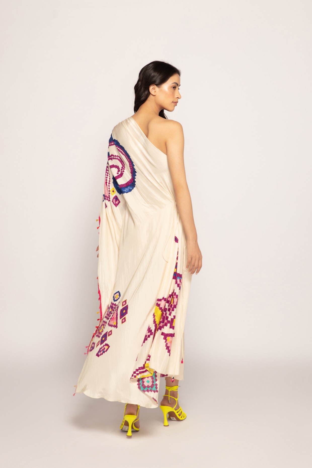 A model showcasing Marigold Print Asymmetric Kaftan Dress by Saaksha And Kinni from Saaksha And Kinni's collection