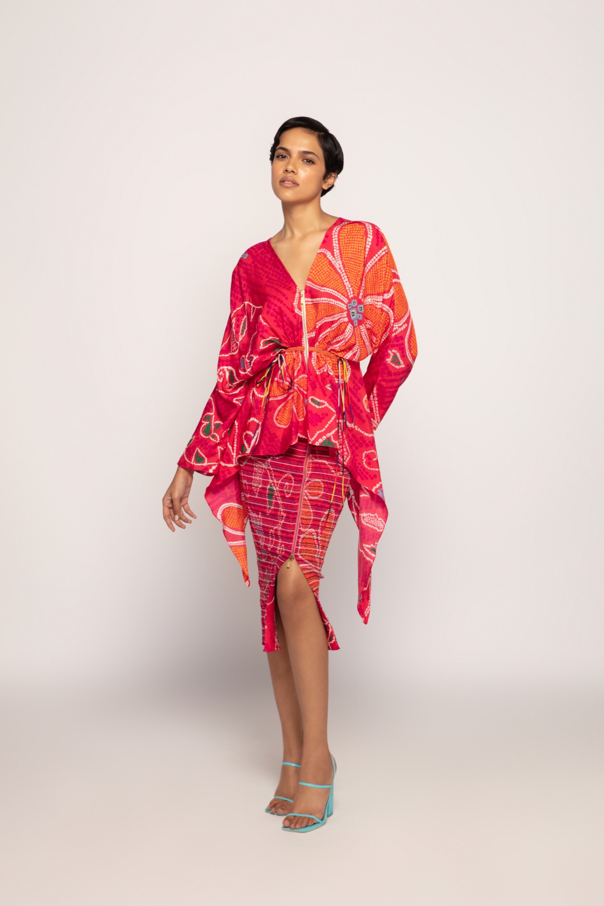 A model showcasing Marigold Bandhani Asymmetric Blouse Feature image by Saaksha And Kinni from Saaksha And Kinni's collection