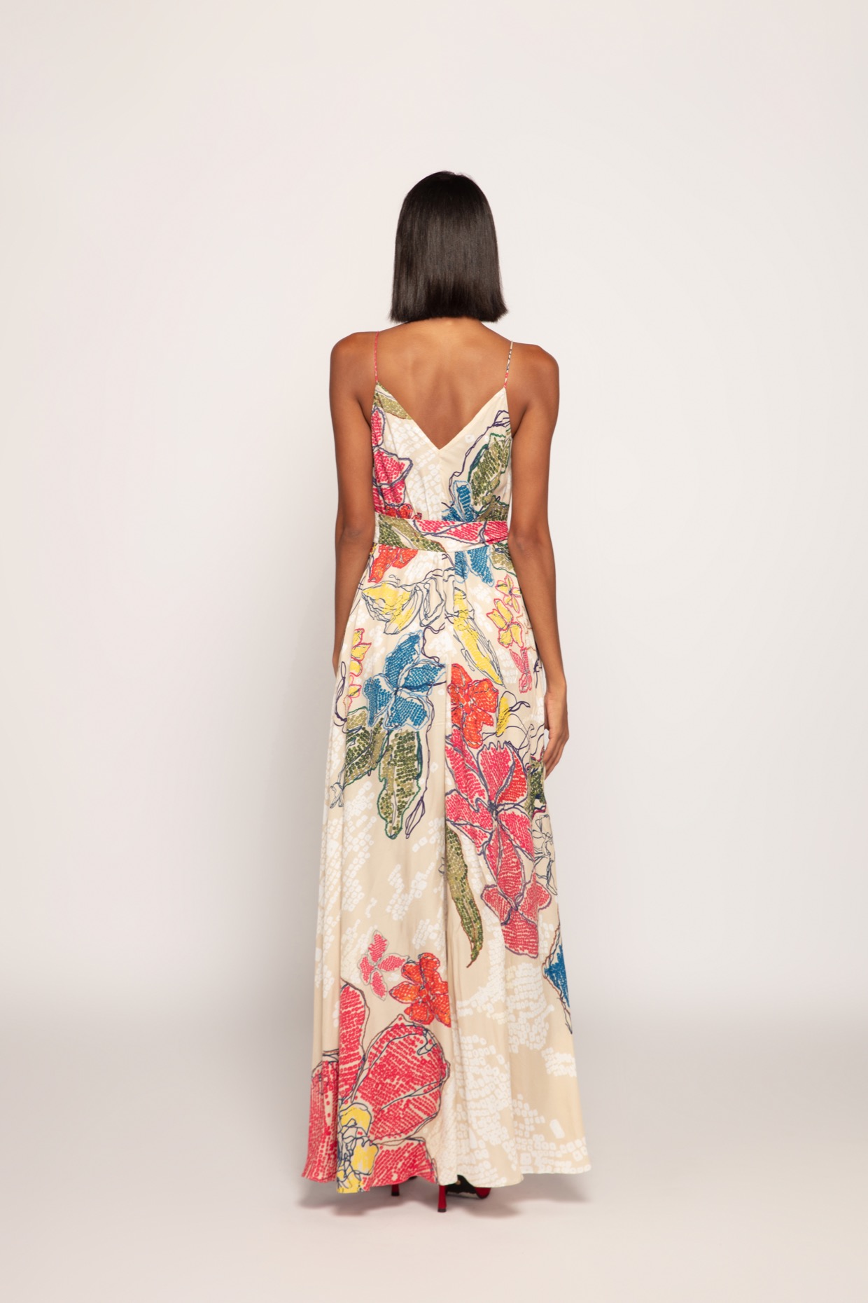 A model showcasing Periwinkle Bandhani Print Ivory Column Dress by Saaksha And Kinni from Saaksha And Kinni's collection