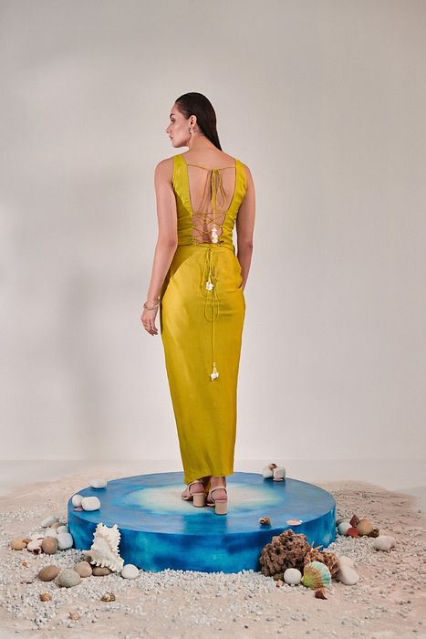 A model showcasing Jacket And Drape Skirt Set In Lime Yellow by One Knot One from One Knot One's collection
