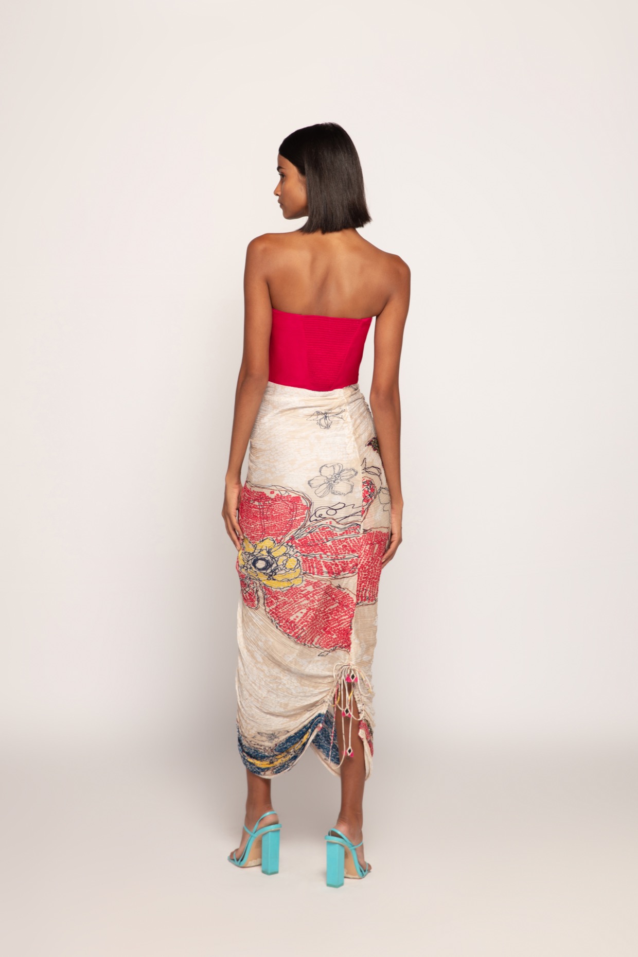 A model showcasing Bandhani Print Pink Ivory Corset Style Dress by Saaksha And Kinni from Saaksha And Kinni's collection