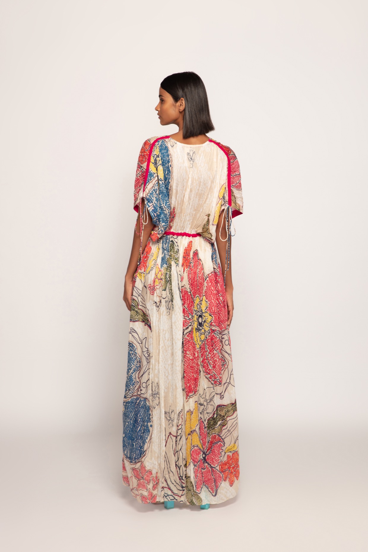 A model showcasing Periwinkle Bandhani Print Kaftan by Saaksha And Kinni from Saaksha And Kinni's collection