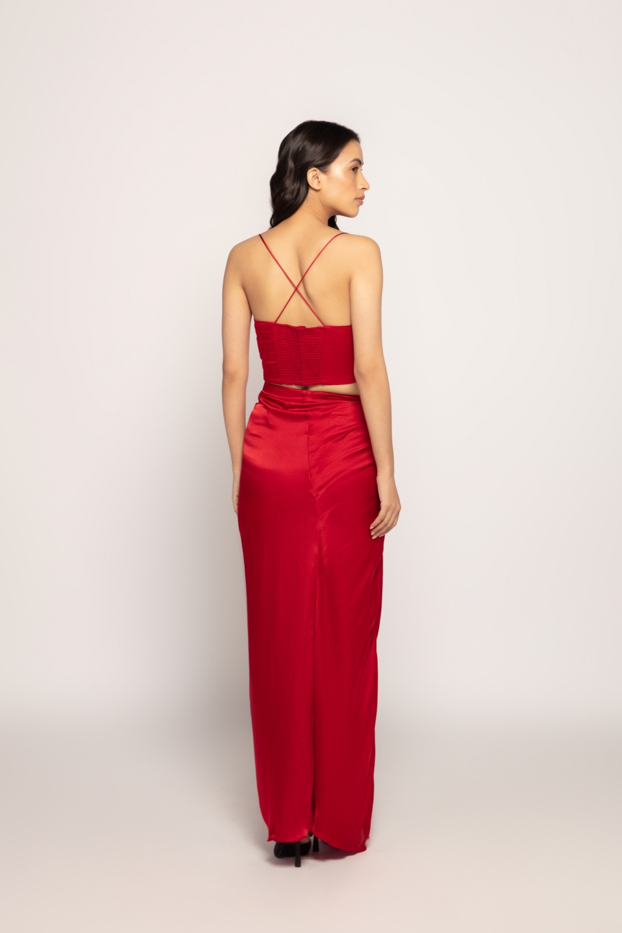A model showcasing Crimson Hand Embroidered Satin Bustier by Saaksha And Kinni from Saaksha And Kinni's collection