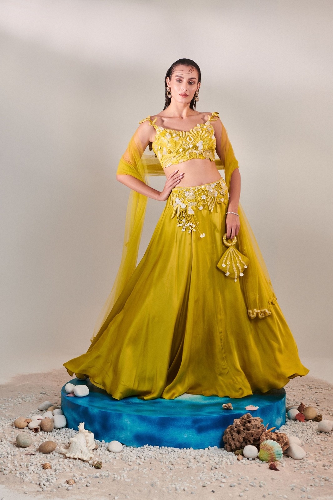 A model showcasing Off Shoulder Cutwork Lehenga Set In Lime Yellow Feature image by One Knot One from One Knot One's collection