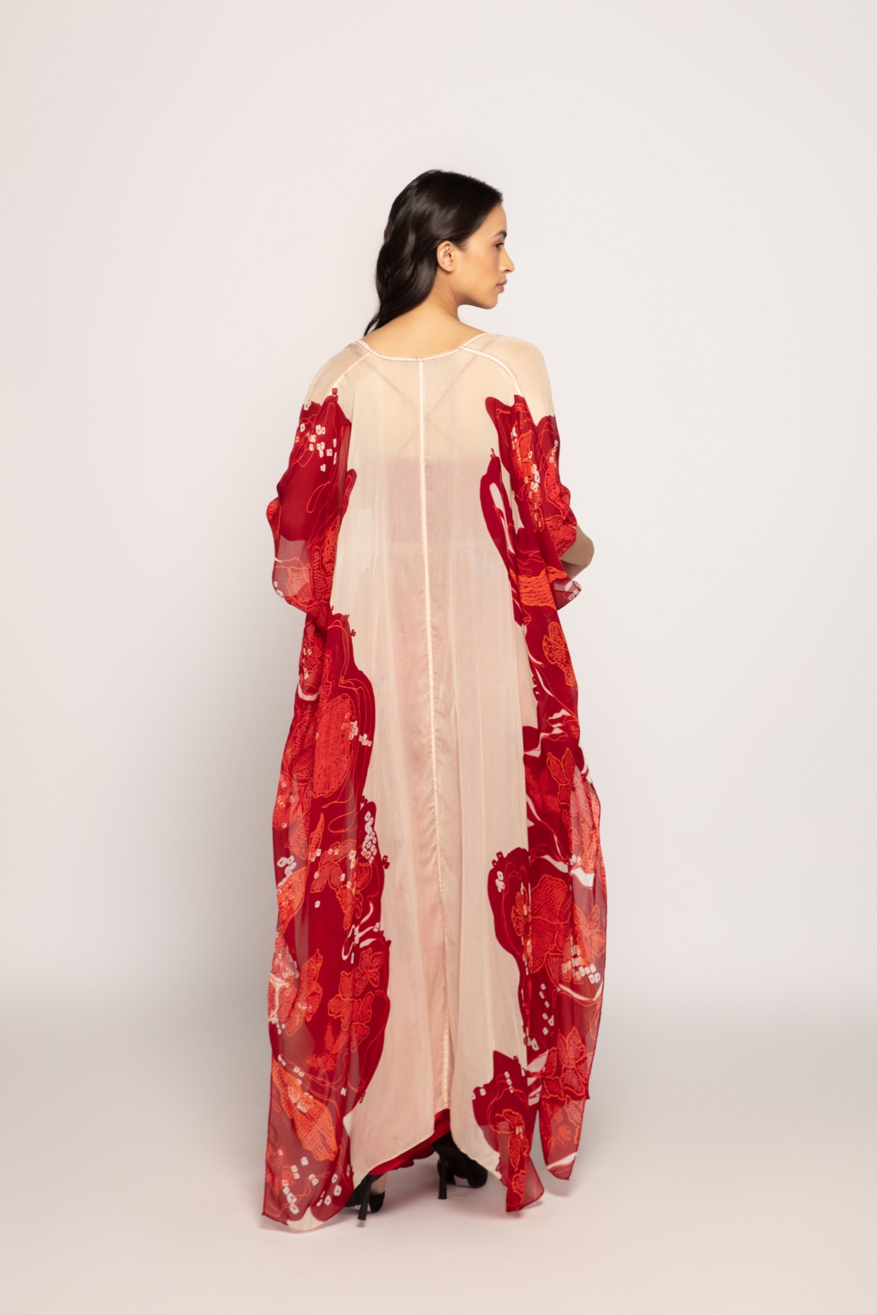 A model showcasing Bandhani Placement Print Long Cape by Saaksha And Kinni from Saaksha And Kinni's collection