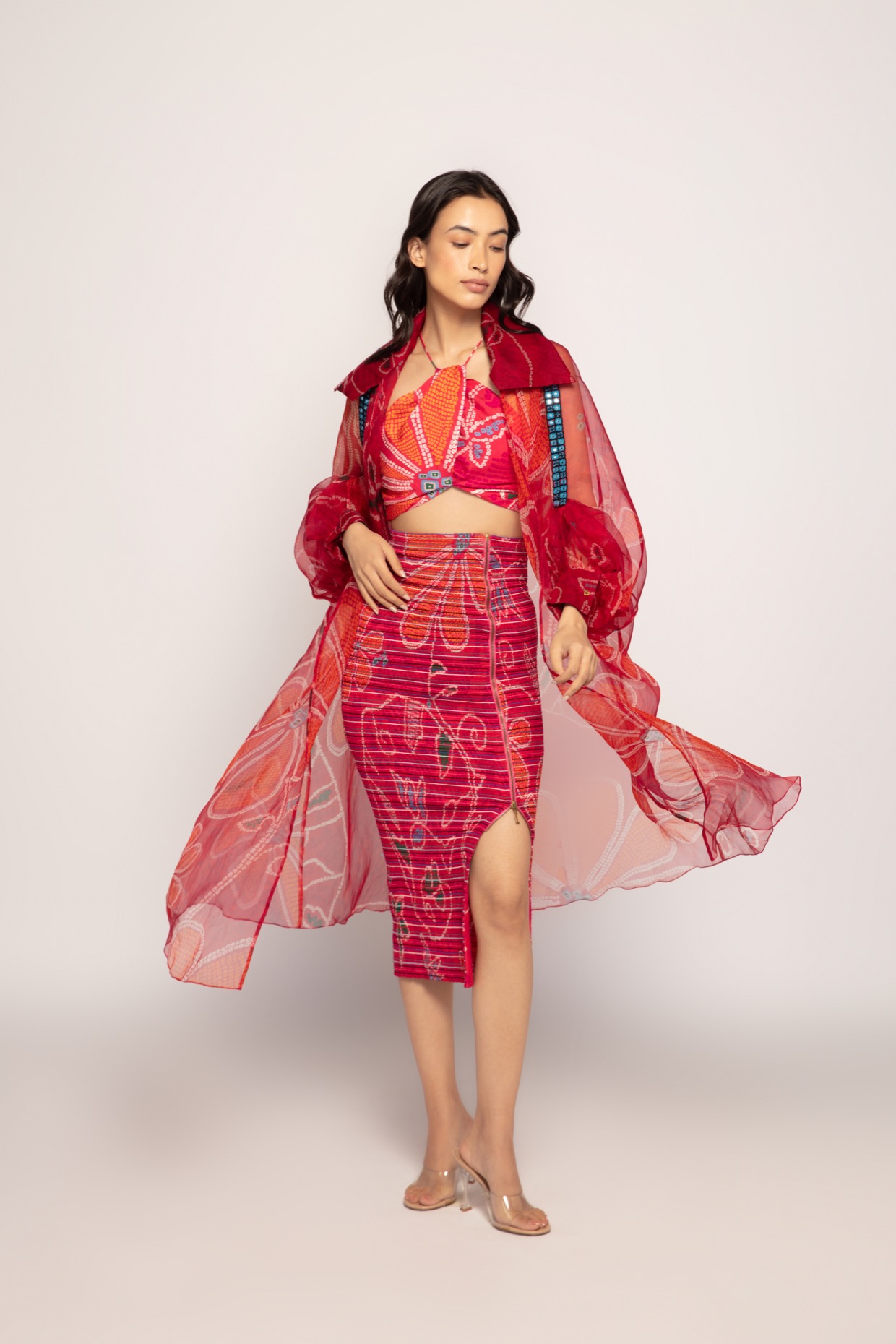 A model showcasing Marigold Print Halter Neck Bralette by Saaksha And Kinni from Saaksha And Kinni's collection