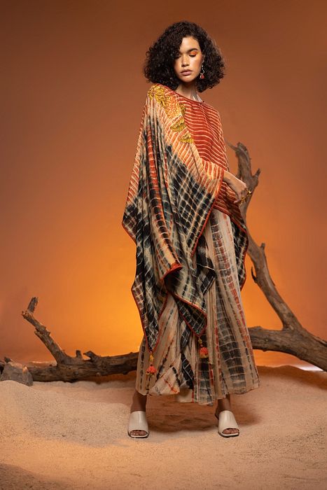 A model showcasing Orange Shikoba Indo Western by Capisvirleo from Capisvirleo's collection