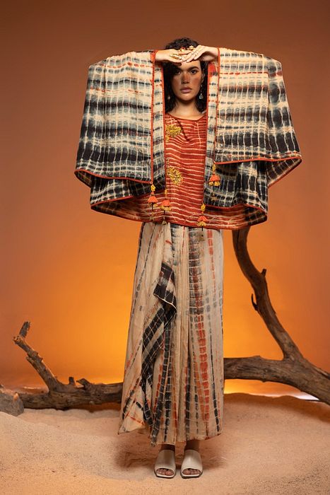 A model showcasing Orange Shikoba Indo Western by Capisvirleo from Capisvirleo's collection