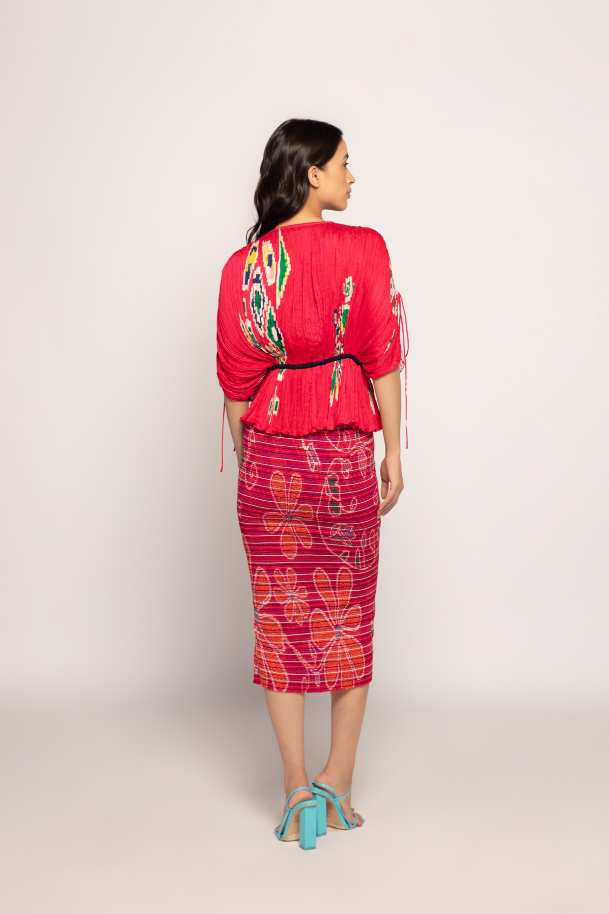 A model showcasing Paisley Print Hot Pink Kaftan Style Blouse by Saaksha And Kinni from Saaksha And Kinni's collection