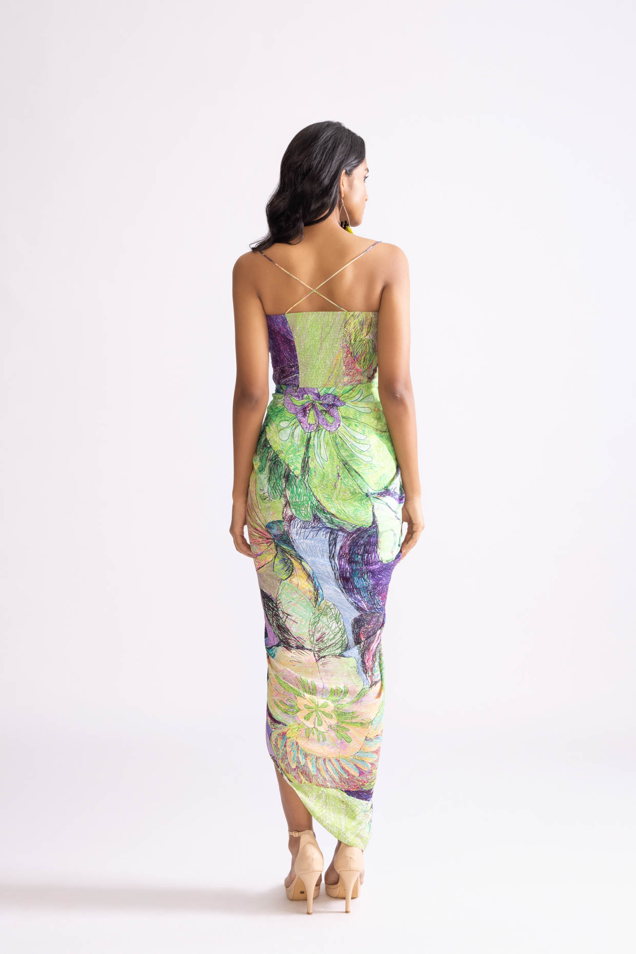 A model showcasing Aura Dress Daisy Printed Draped Dress by Saaksha And Kinni from Saaksha And Kinni's collection
