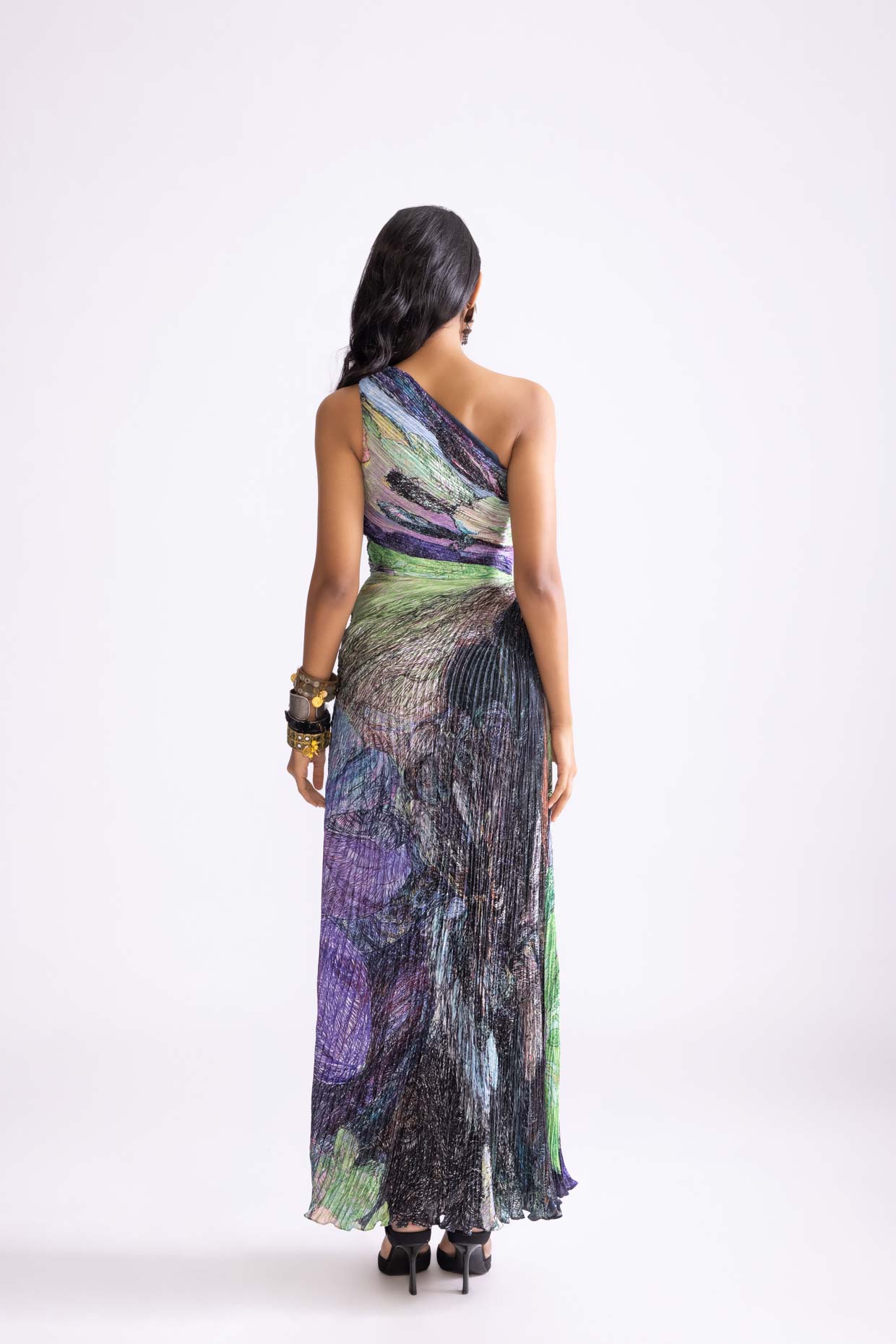 A model showcasing Cleo Dress Daisy Print Pleat Maxi Dress by Saaksha And Kinni from Saaksha And Kinni's collection