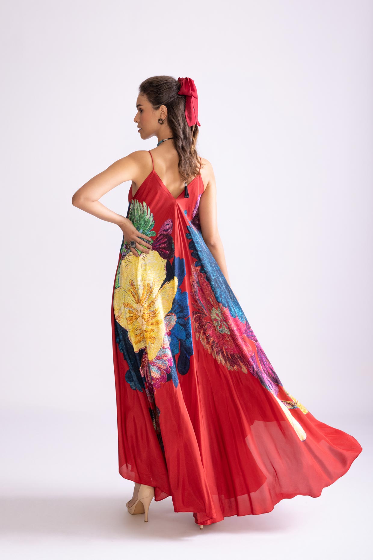 A model showcasing Yazmine Dress Daisy Print Asymmetric Dress by Saaksha And Kinni from Saaksha And Kinni's collection