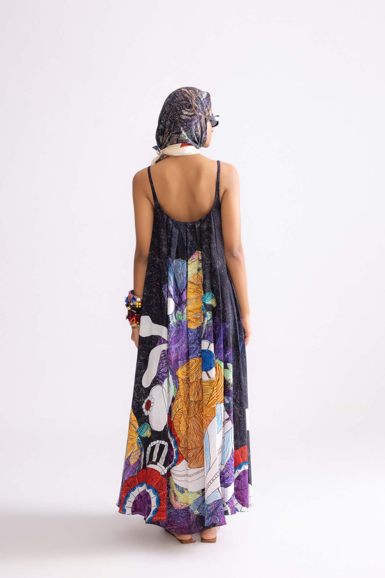 A model showcasing Swing Dress Tribal Print Flared Maxi Dress by Saaksha And Kinni from Saaksha And Kinni's collection