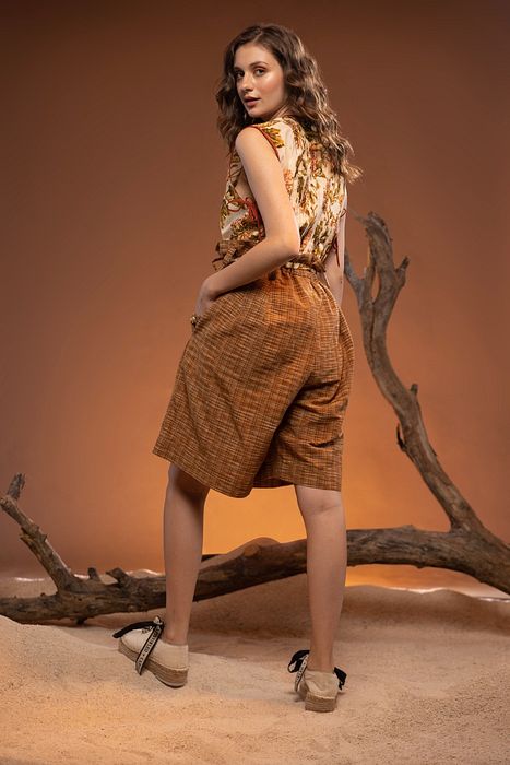 A model showcasing Hazel Brown Mehogany Jacket by Capisvirleo from Capisvirleo's collection