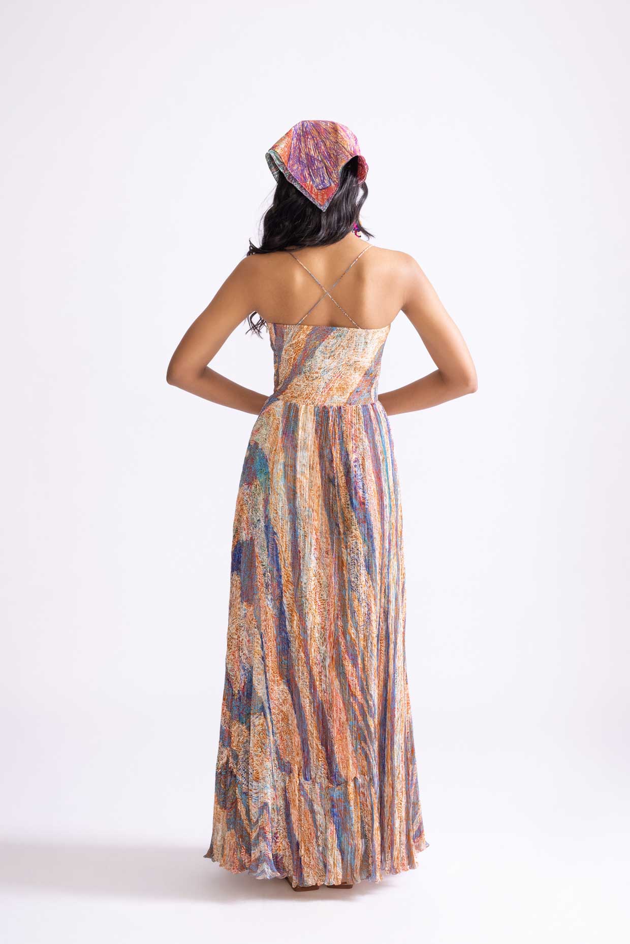 A model showcasing Kiara Dress Micro Pleat Maxi Dress by Saaksha And Kinni from Saaksha And Kinni's collection