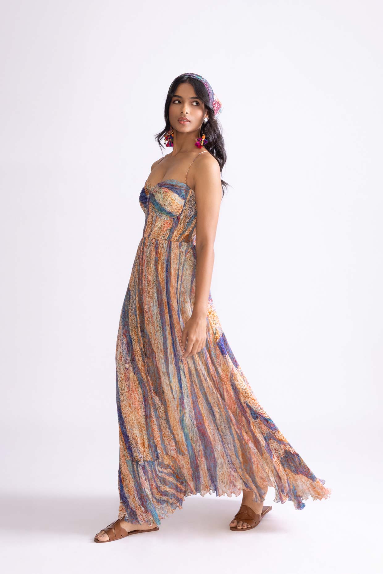 A model showcasing Kiara Dress Micro Pleat Maxi Dress by Saaksha And Kinni from Saaksha And Kinni's collection