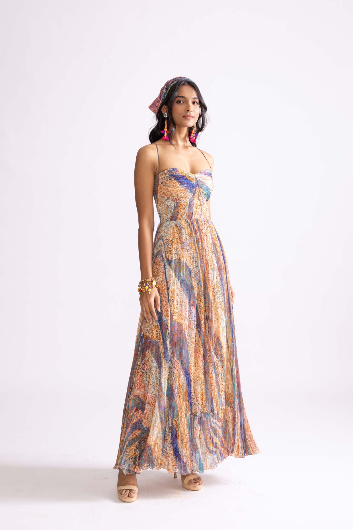 A model showcasing Kiara Dress Micro Pleat Maxi Dress by Saaksha And Kinni from Saaksha And Kinni's collection