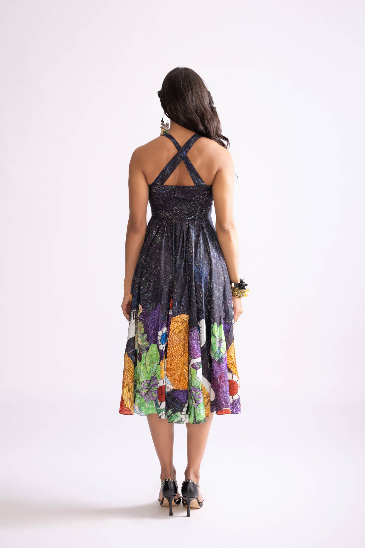 A model showcasing Addison Dress Tribal Print Empire Cut Dress by Saaksha And Kinni from Saaksha And Kinni's collection