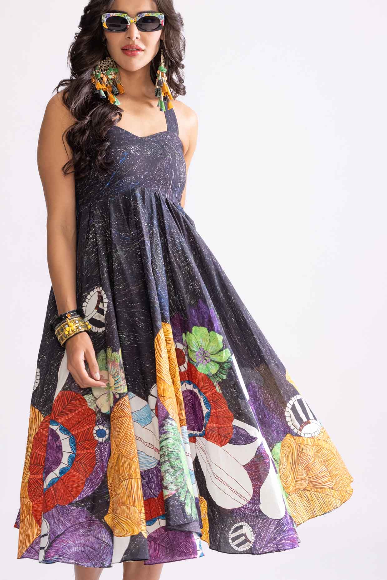 A model showcasing Addison Dress Tribal Print Empire Cut Dress by Saaksha And Kinni from Saaksha And Kinni's collection