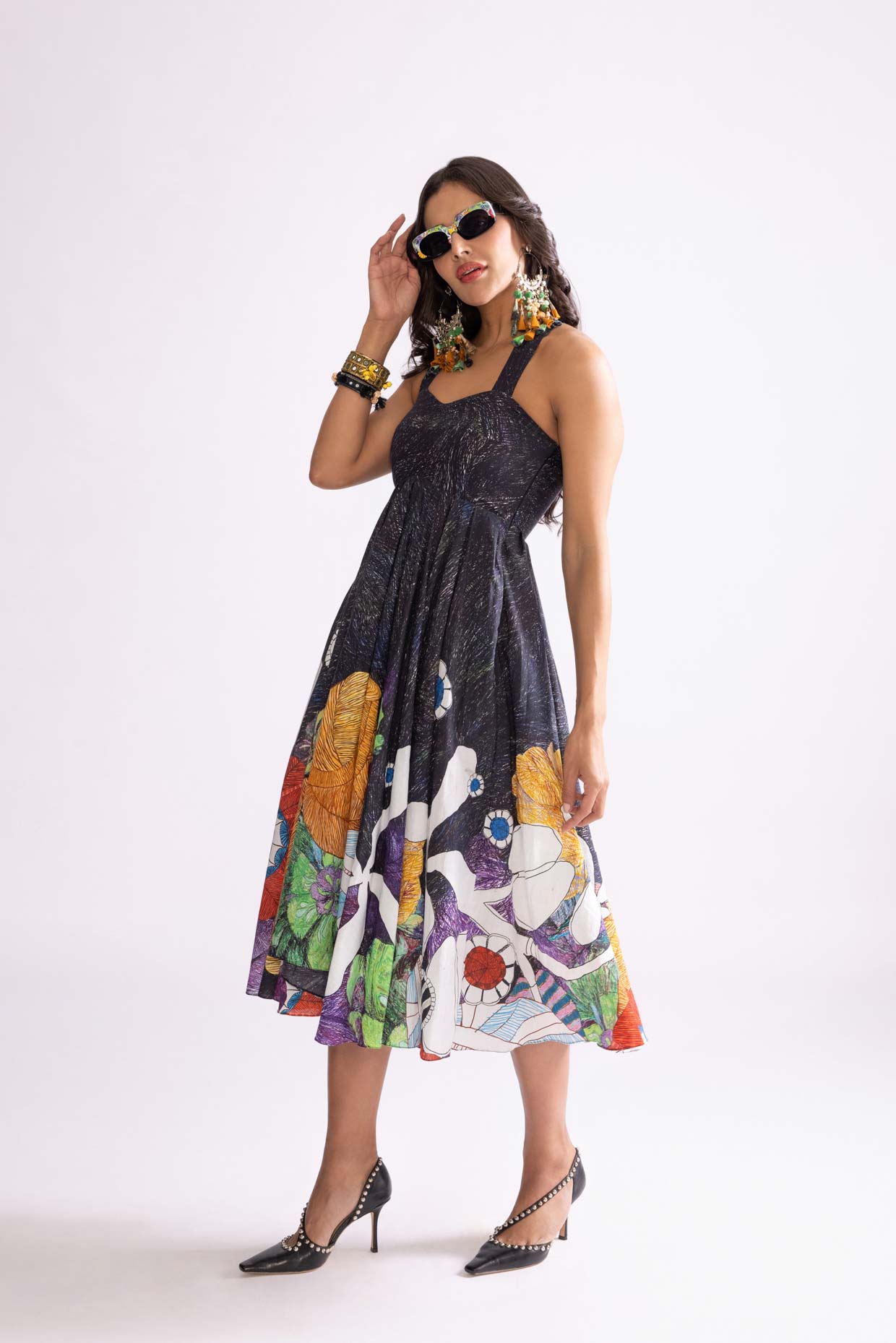 A model showcasing Addison Dress Tribal Print Empire Cut Dress by Saaksha And Kinni from Saaksha And Kinni's collection