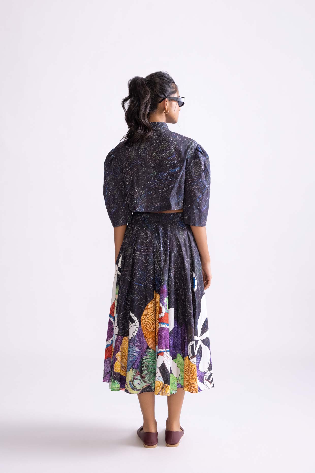 A model showcasing Nikki Shirt Wave Print Cropped Shirt by Saaksha And Kinni from Saaksha And Kinni's collection
