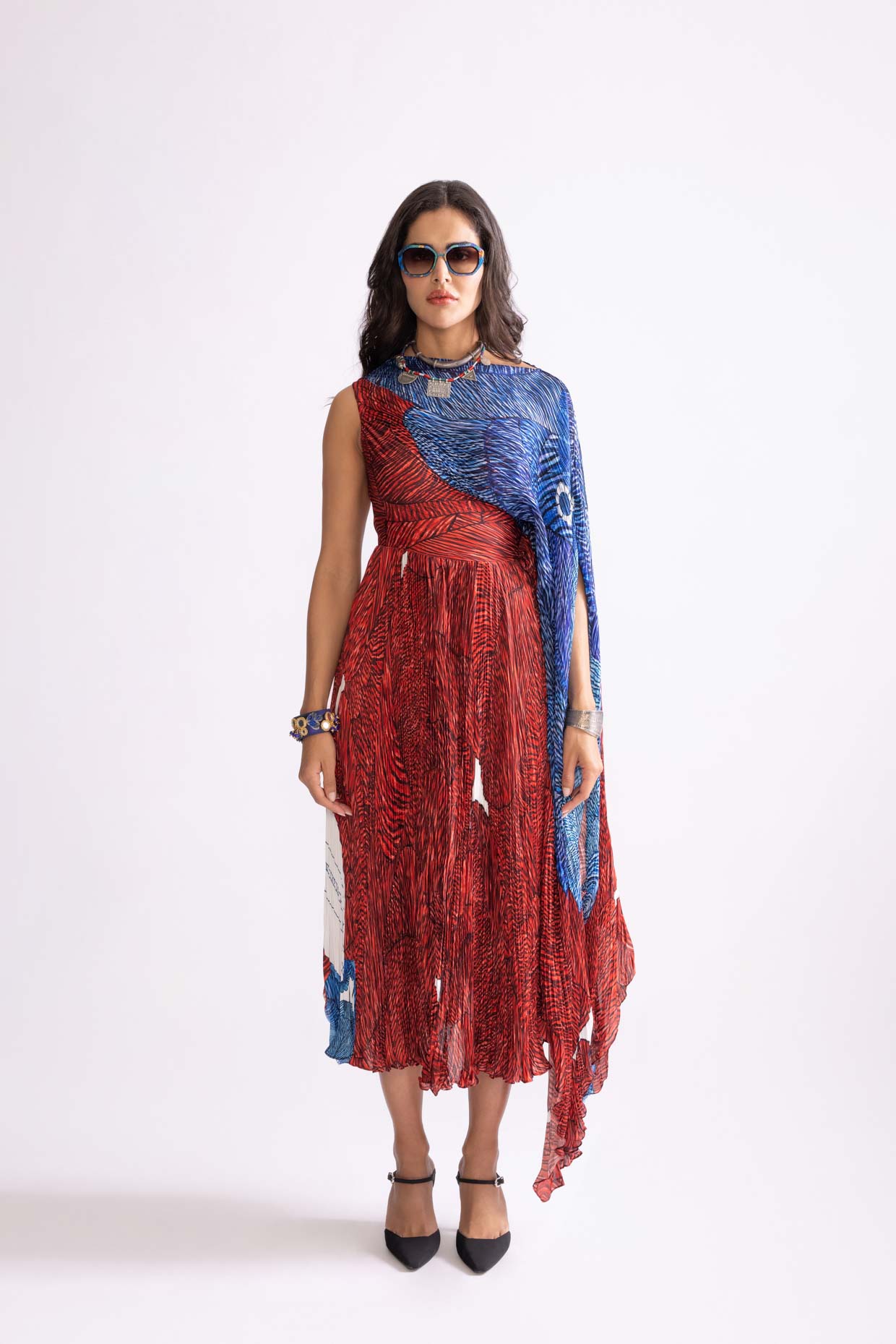 A model showcasing Abigail Dress Wave Print Micro Pleat Dress by Saaksha And Kinni from Saaksha And Kinni's collection