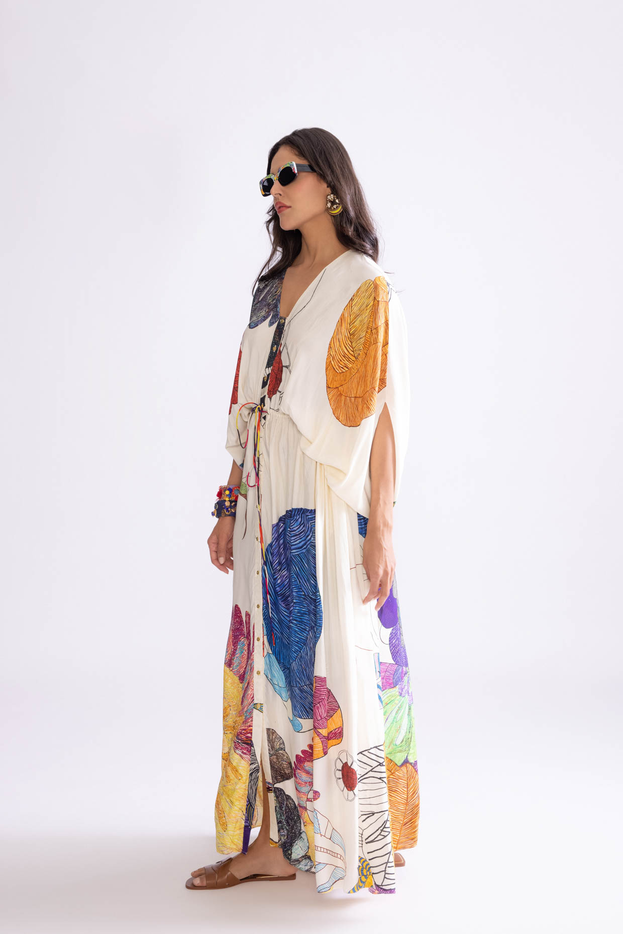 A model showcasing Shiloh Kaftan Tribal Print Kaftan Dress by Saaksha And Kinni from Saaksha And Kinni's collection