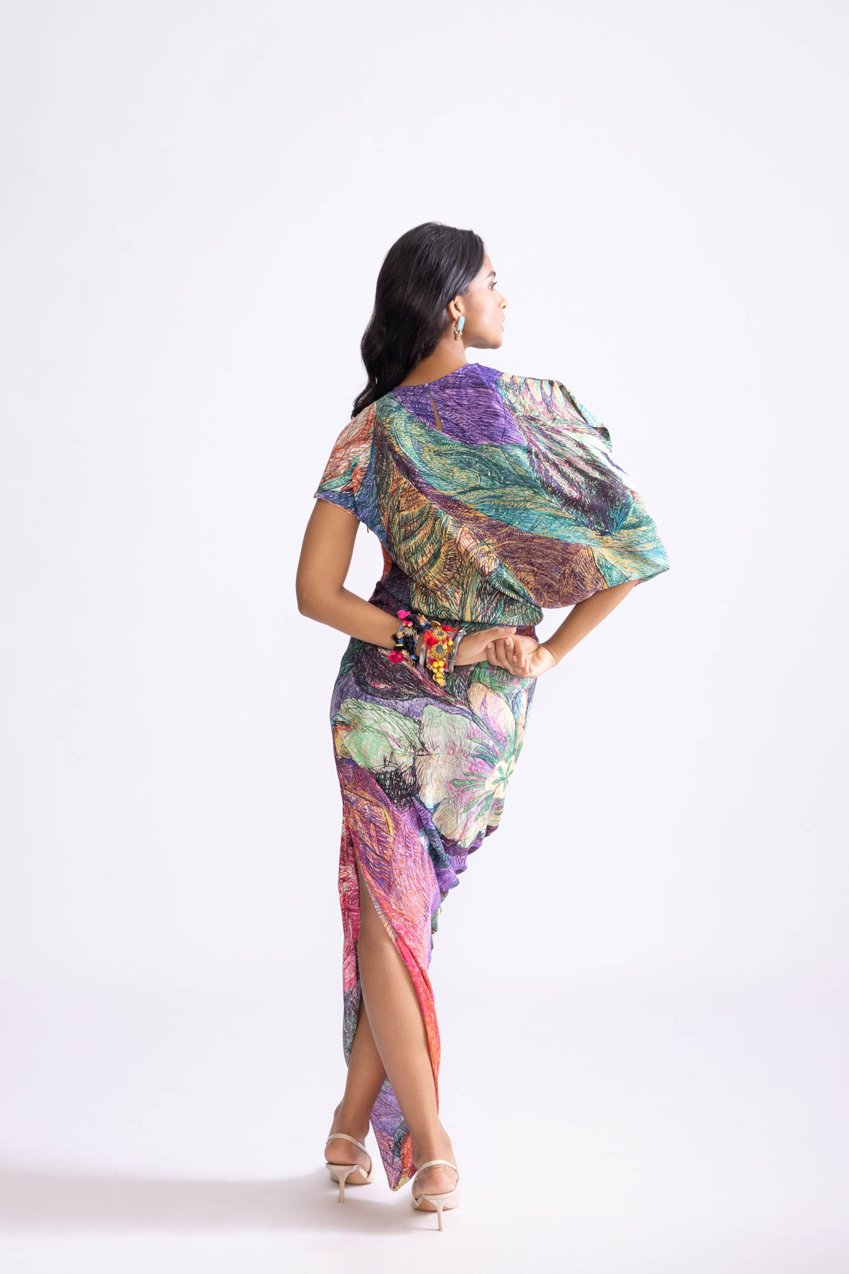 A model showcasing Kai Dress Daisy Print Kaftan Drape Dress by Saaksha And Kinni from Saaksha And Kinni's collection