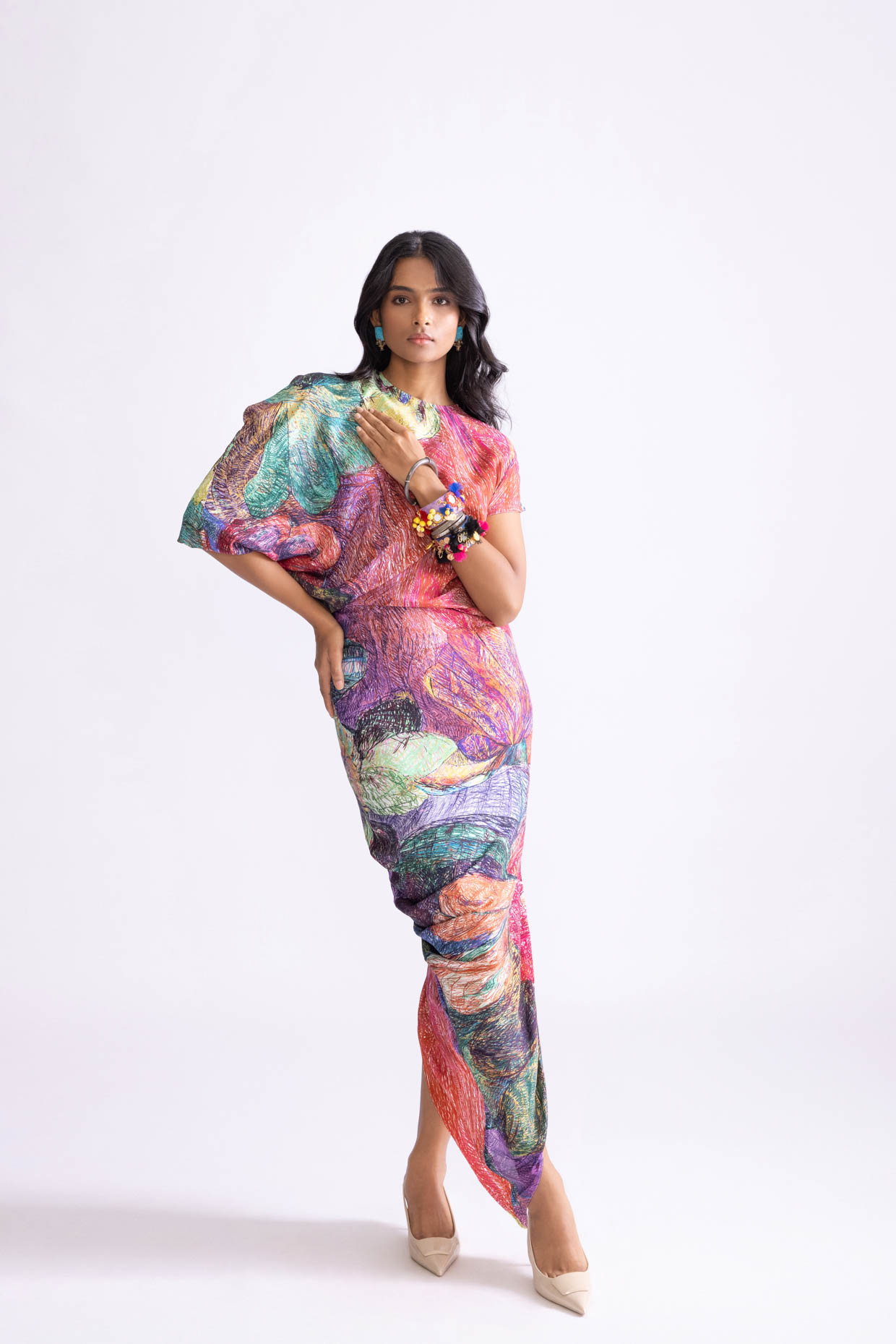 A model showcasing Kai Dress Daisy Print Kaftan Drape Dress by Saaksha And Kinni from Saaksha And Kinni's collection