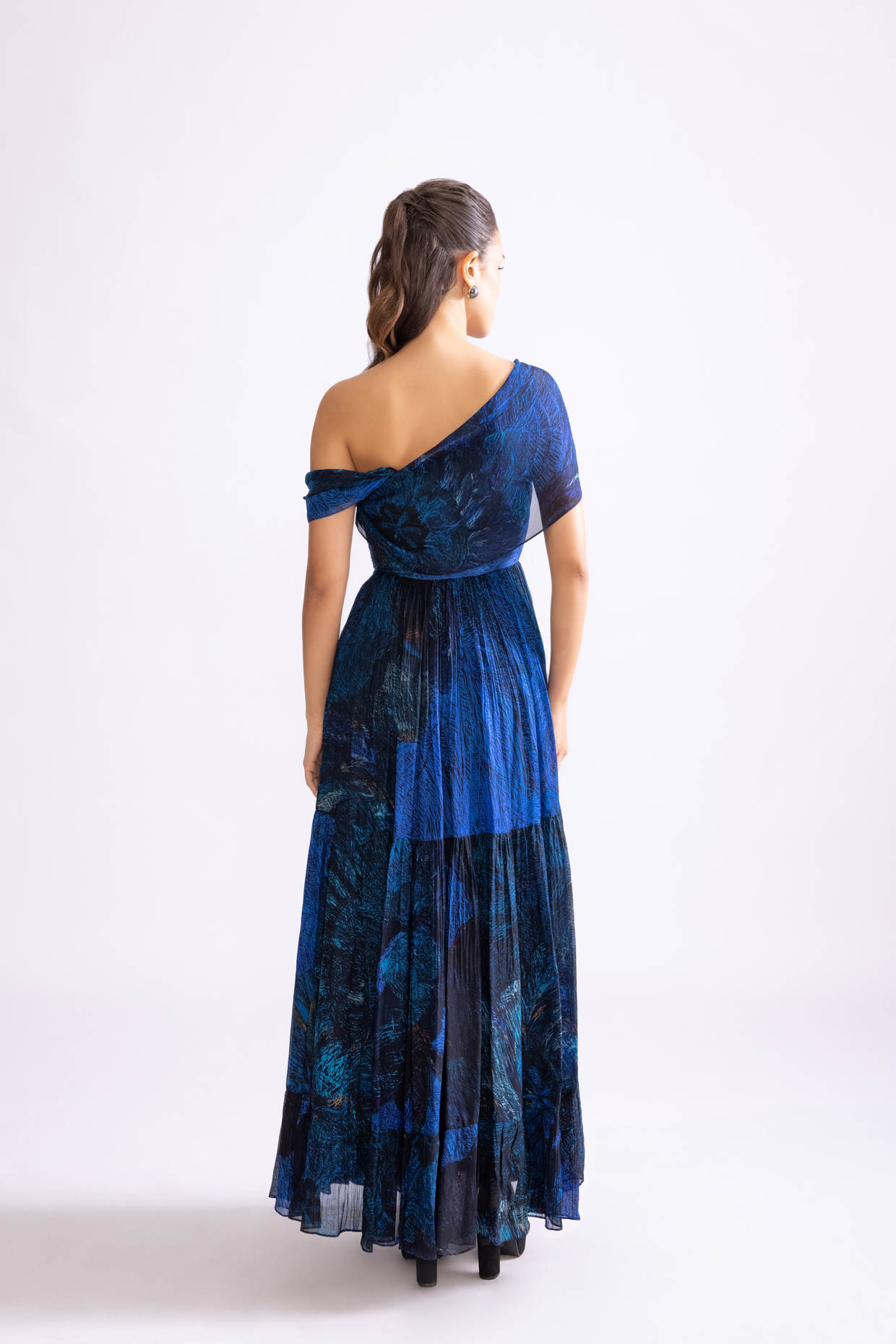 A model showcasing Freya Dress Daisy Print Tiered Dress by Saaksha And Kinni from Saaksha And Kinni's collection