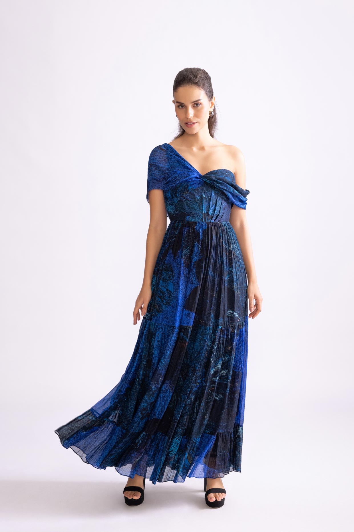 A model showcasing Freya Dress Daisy Print Tiered Dress by Saaksha And Kinni from Saaksha And Kinni's collection