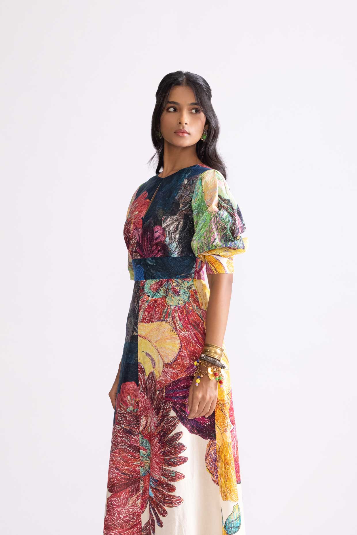 A model showcasing Daisy Dress Daisy Print A Line Dress by Saaksha And Kinni from Saaksha And Kinni's collection