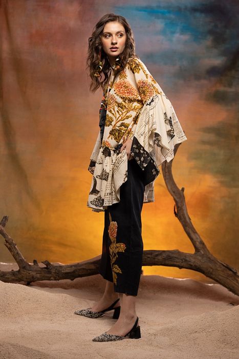 A model showcasing Ivory Tamarind Dress by Capisvirleo from Capisvirleo's collection