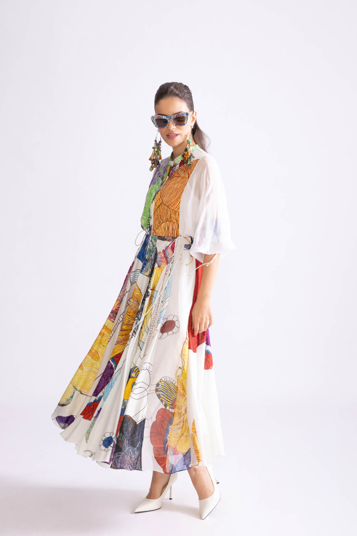 A model showcasing Meagen Dress Daisy And Tribal Ptrint Midi Dress by Saaksha And Kinni from Saaksha And Kinni's collection