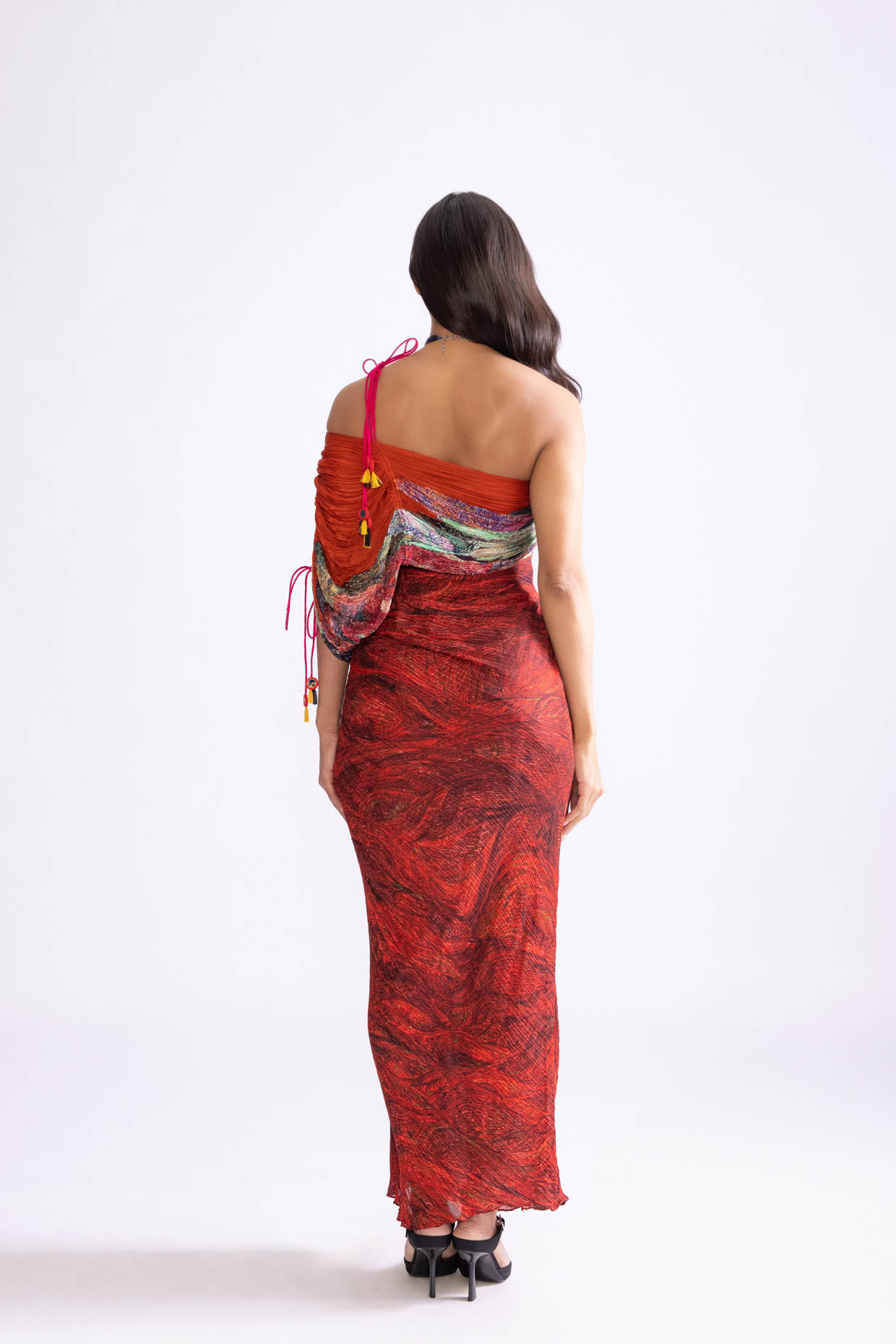 A model showcasing Raleigh Dress Wave And Daisy Print Red Maxi Dress by Saaksha And Kinni from Saaksha And Kinni's collection