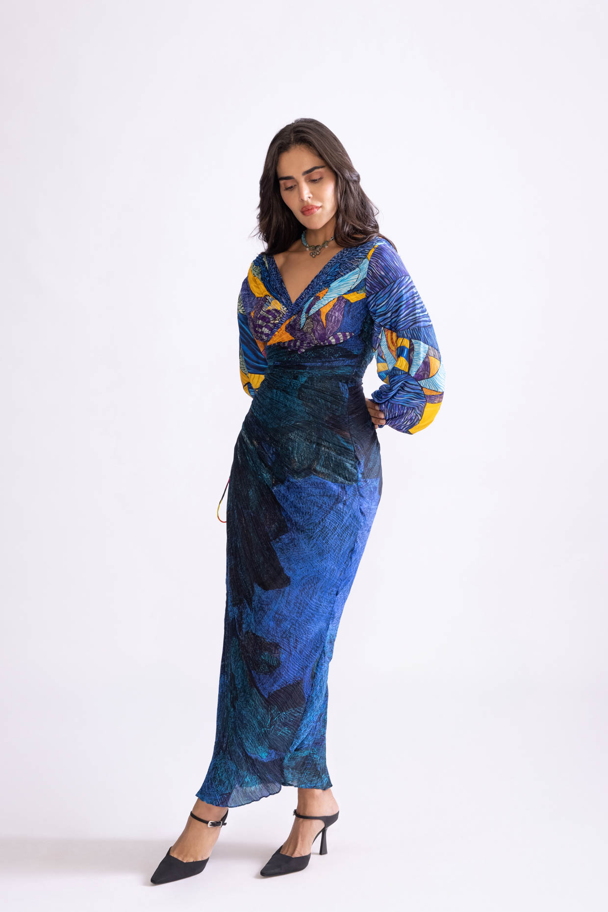 A model showcasing Eloise Dress Daisy And Tribal Print Slit Dress by Saaksha And Kinni from Saaksha And Kinni's collection