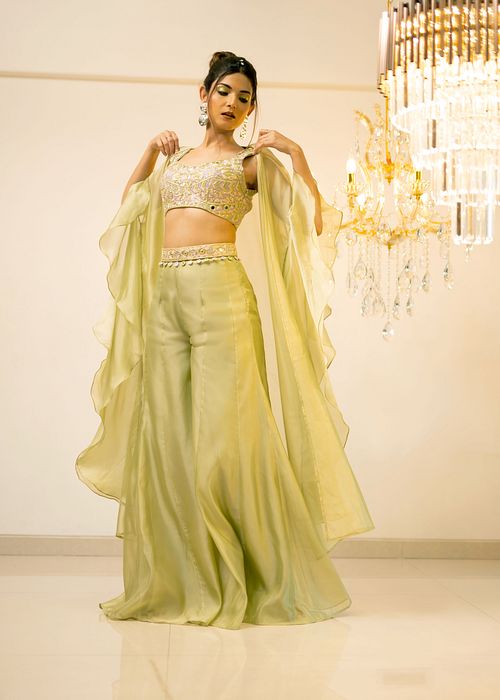 A model showcasing Green Organza Sharara Cape Set by Foram Patel from Foram Patel's collection