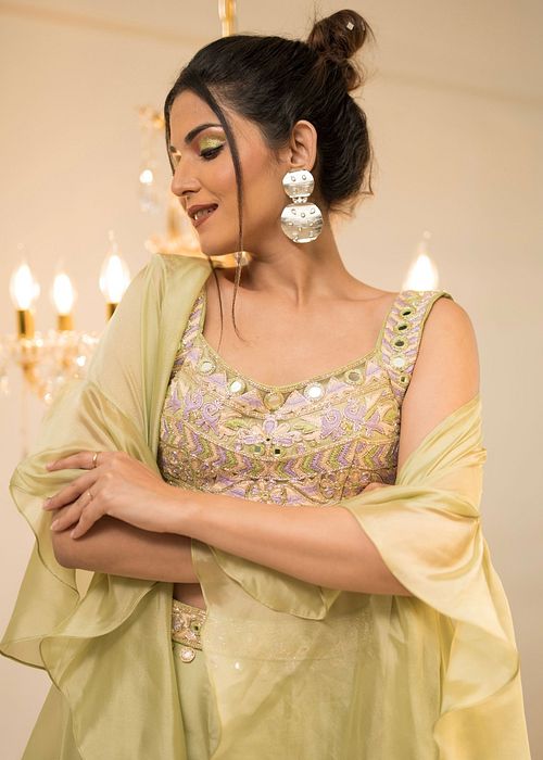 A model showcasing Green Organza Sharara Cape Set by Foram Patel from Foram Patel's collection