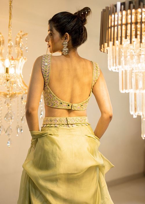 A model showcasing Green Organza Sharara Cape Set by Foram Patel from Foram Patel's collection