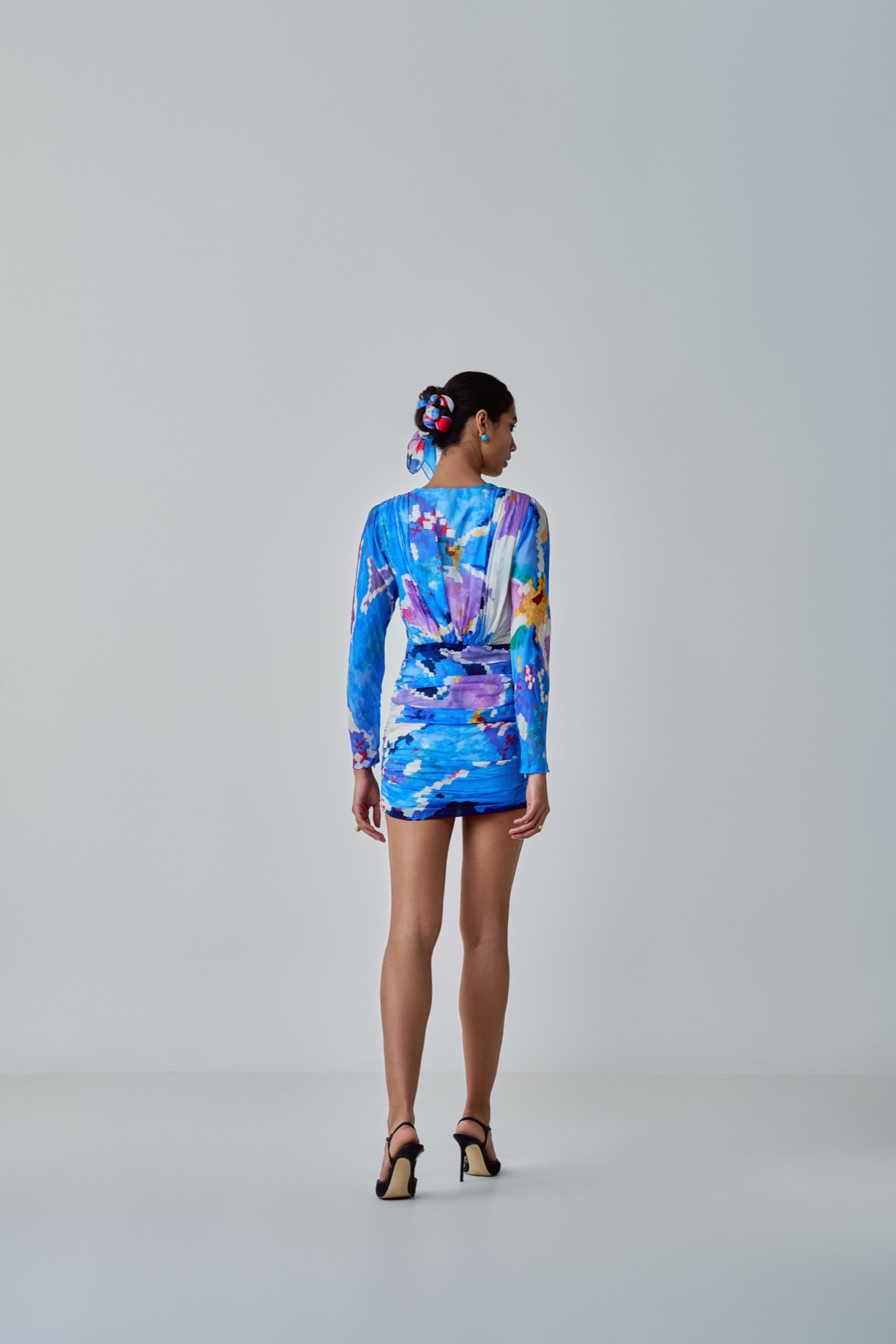 A model showcasing Lily Dress Blue Long Sleeve Mini Dress by Saaksha And Kinni from Saaksha And Kinni's collection