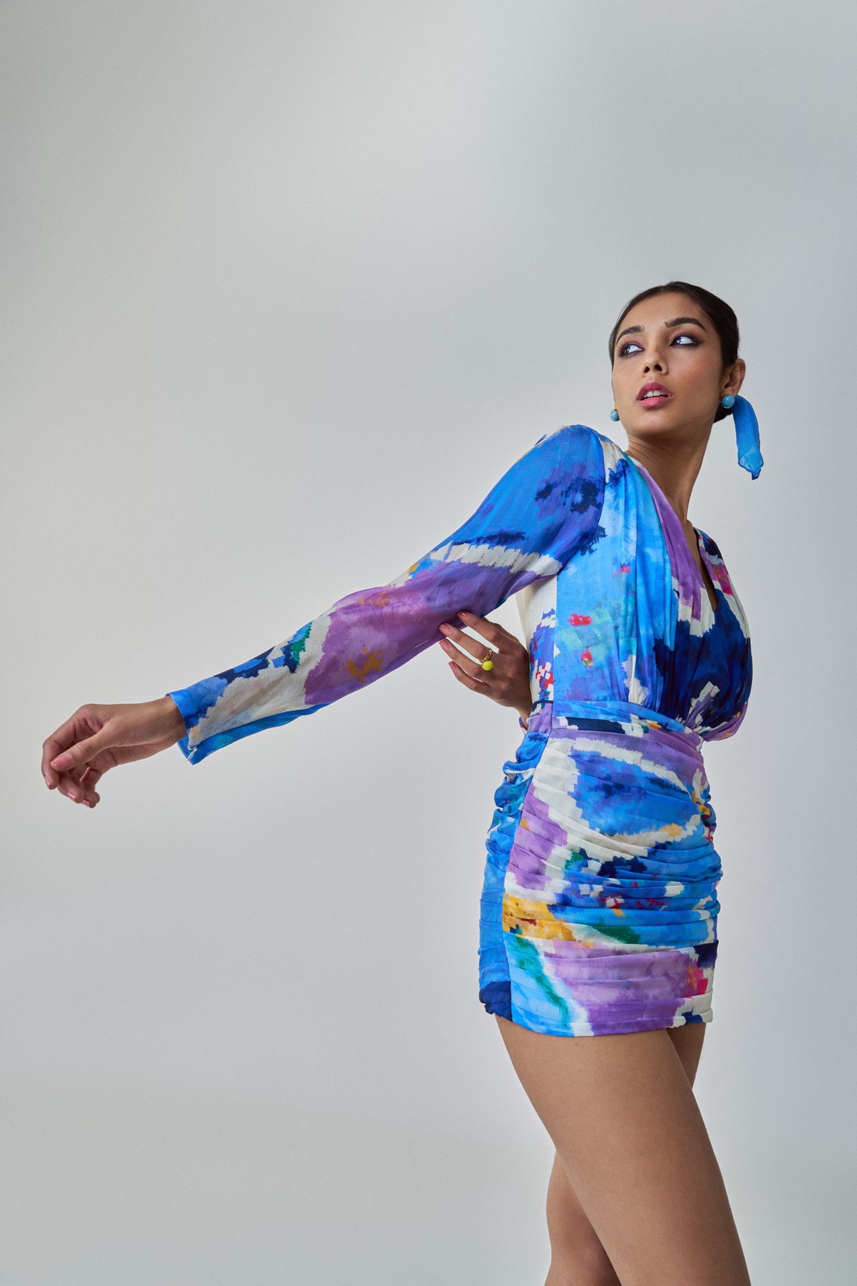 A model showcasing Lily Dress Blue Long Sleeve Mini Dress by Saaksha And Kinni from Saaksha And Kinni's collection