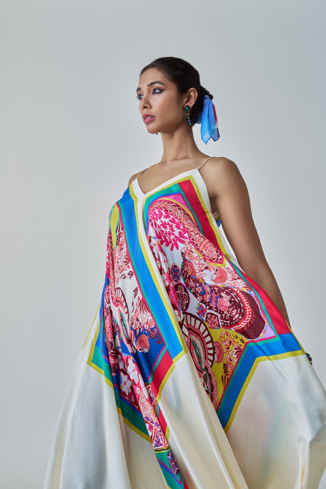 A model showcasing Yazmine Dress Paisley Print Asymmetric Dress by Saaksha And Kinni from Saaksha And Kinni's collection