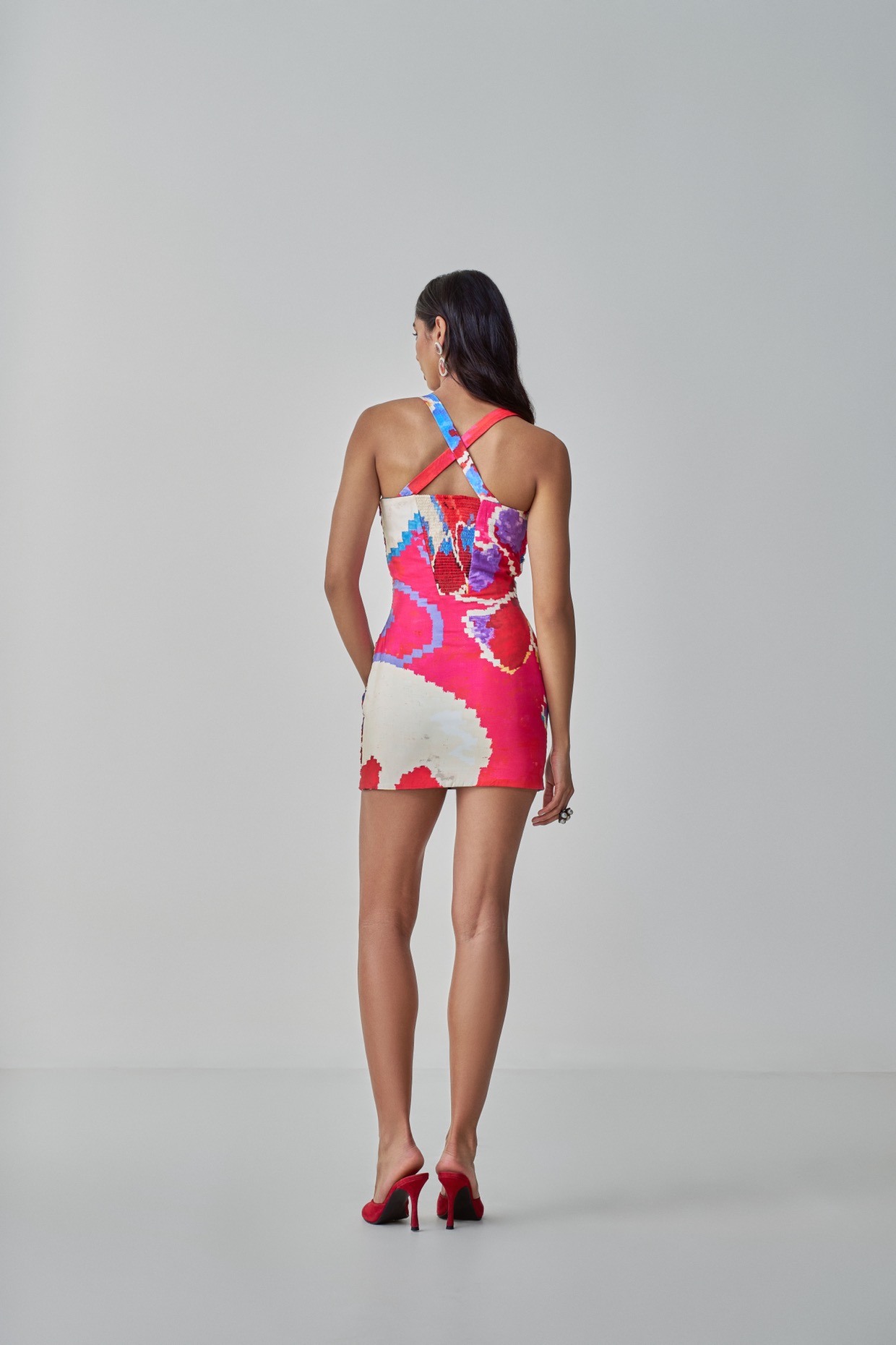 A model showcasing Millie Dress Red Pink Mini Dress by Saaksha And Kinni from Saaksha And Kinni's collection
