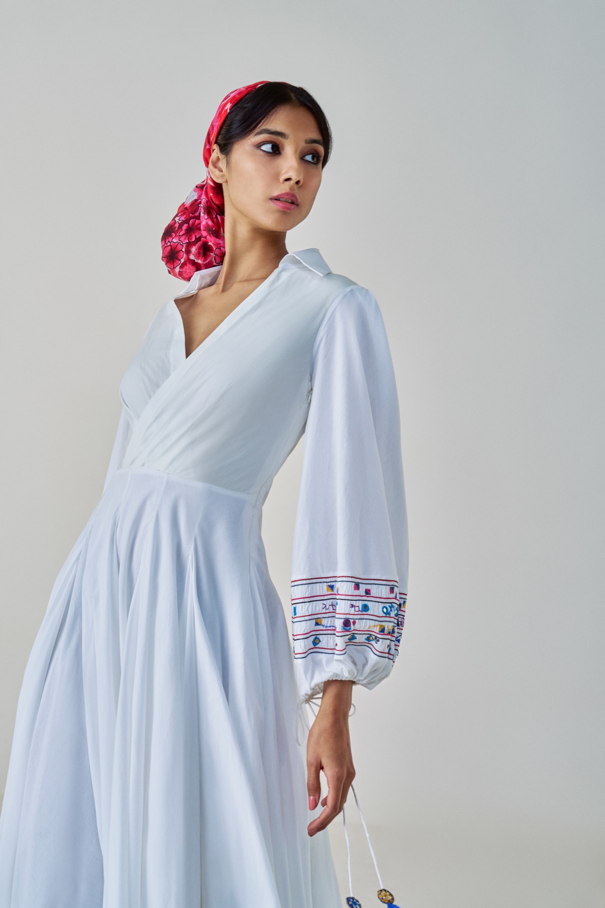 A model showcasing Annie Dress White Midi Dress by Saaksha And Kinni from Saaksha And Kinni's collection