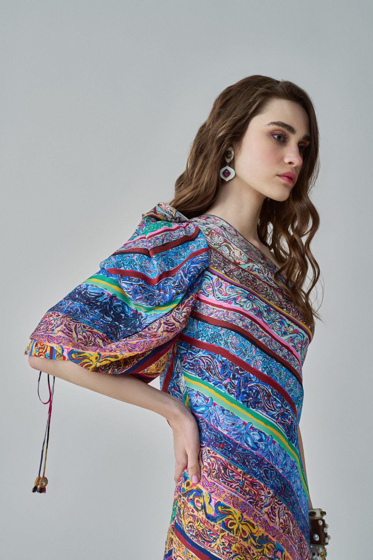A model showcasing Alina Dress One Shoulder Maxi Dress by Saaksha And Kinni from Saaksha And Kinni's collection