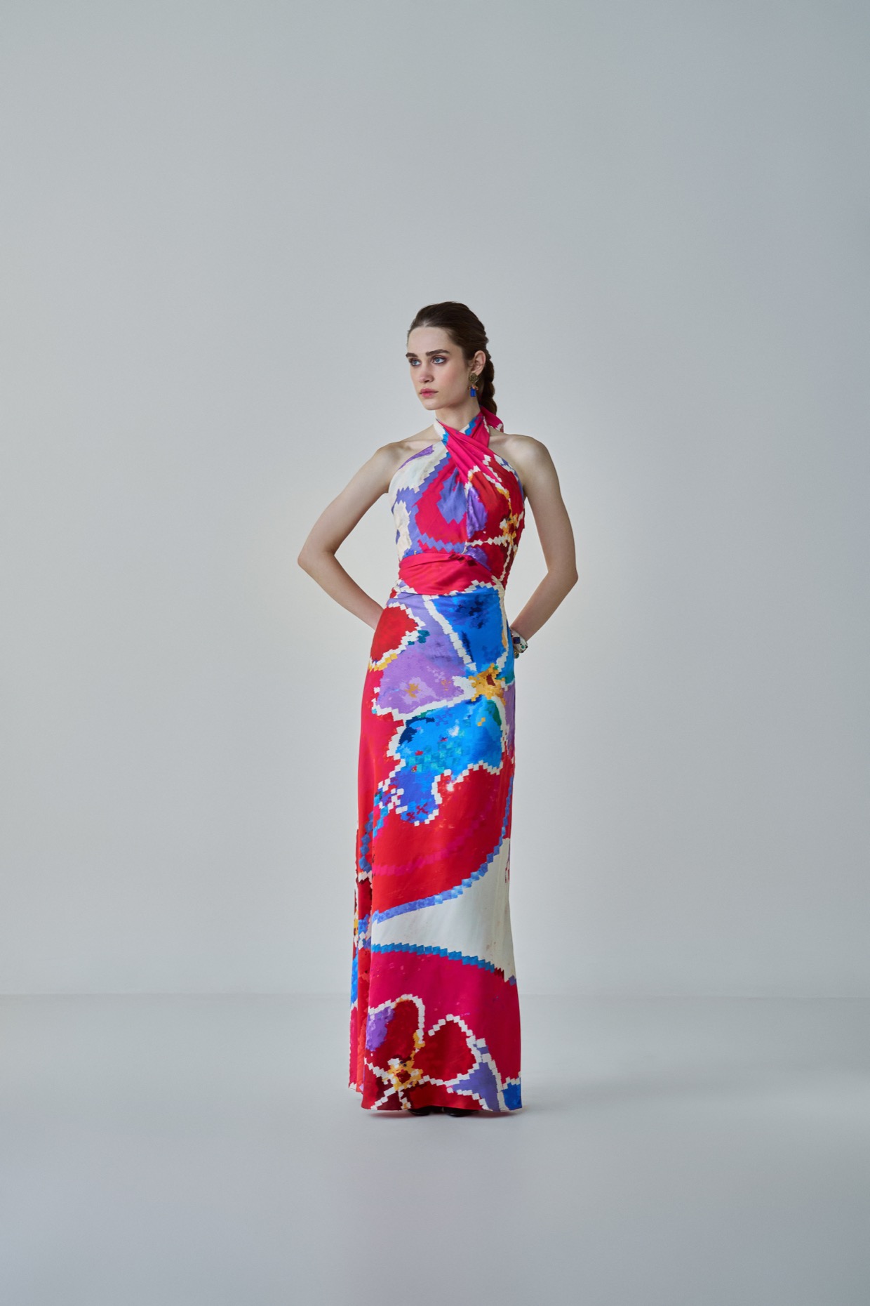A model showcasing Shailee Dress Pink Red Halter Neck Dress Feature image by Saaksha And Kinni from Saaksha And Kinni's collection