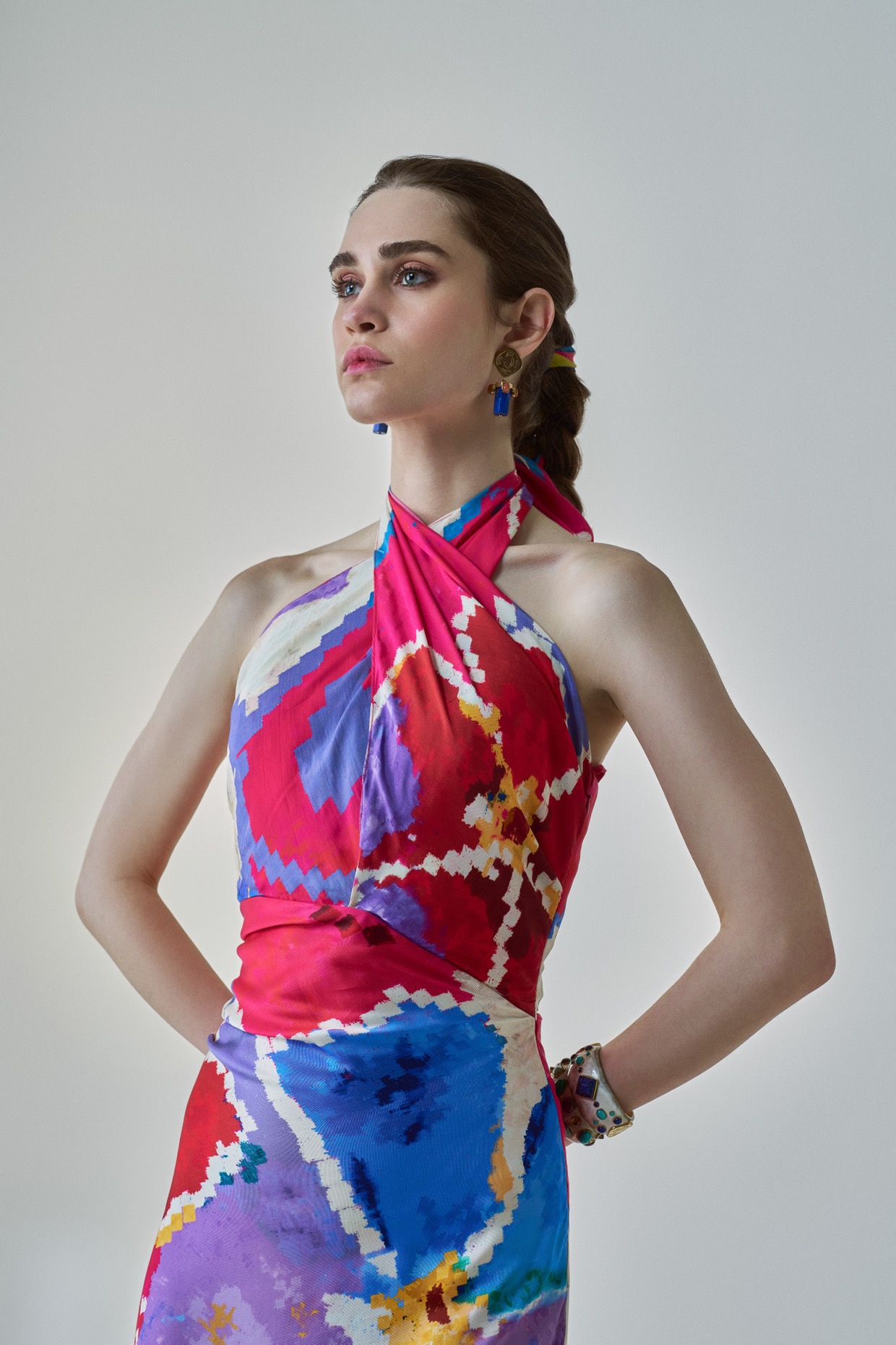 A model showcasing Shailee Dress Pink Red Halter Neck Dress by Saaksha And Kinni from Saaksha And Kinni's collection