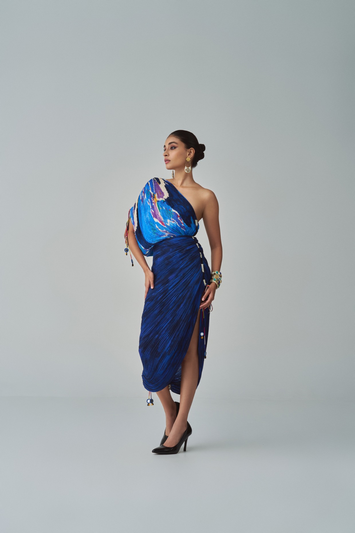 A model showcasing Mira Dress Blue One Shoulder Dress by Saaksha And Kinni from Saaksha And Kinni's collection