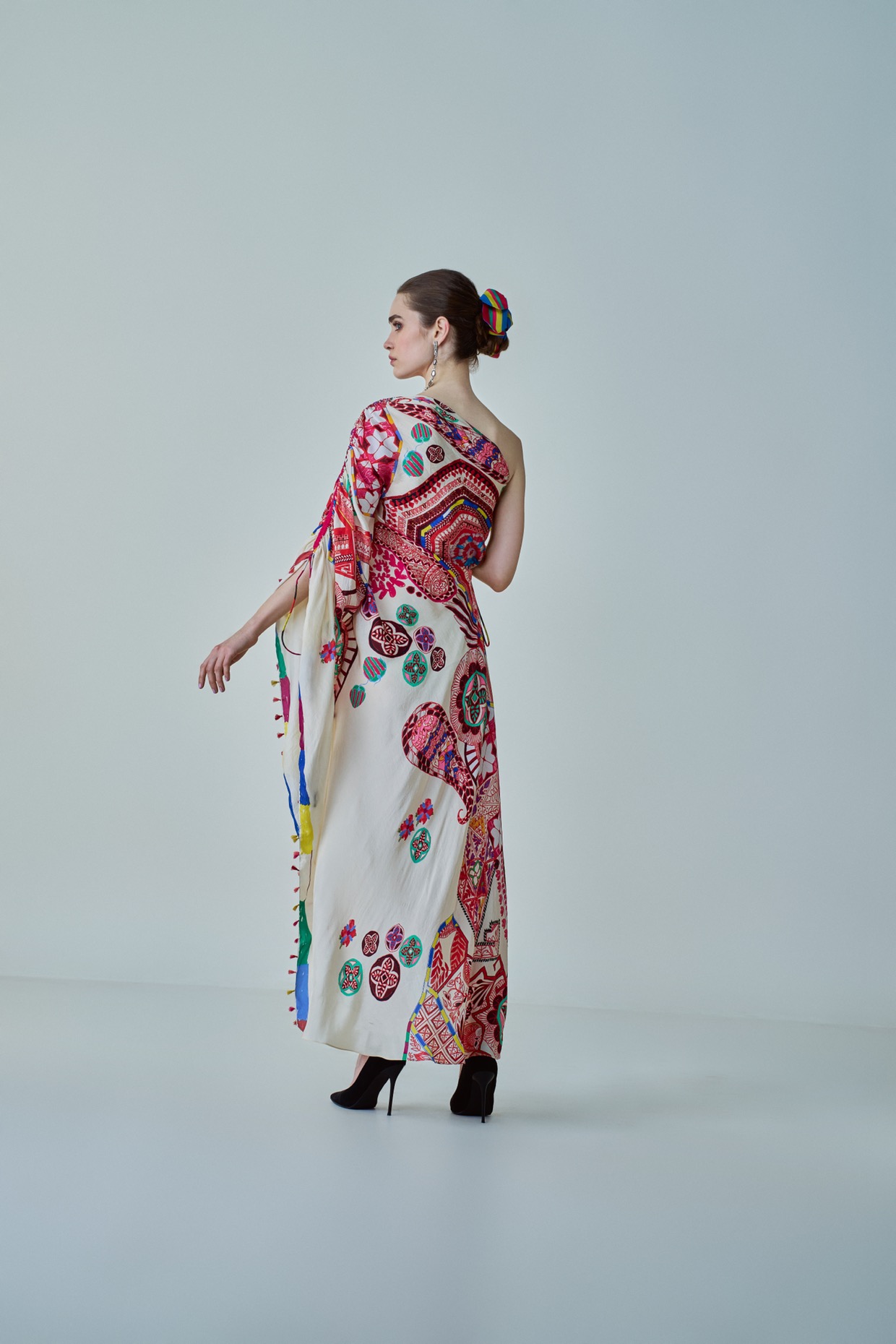A model showcasing Isla Kaftan Asymmetric One Shoulder Kaftan by Saaksha And Kinni from Saaksha And Kinni's collection