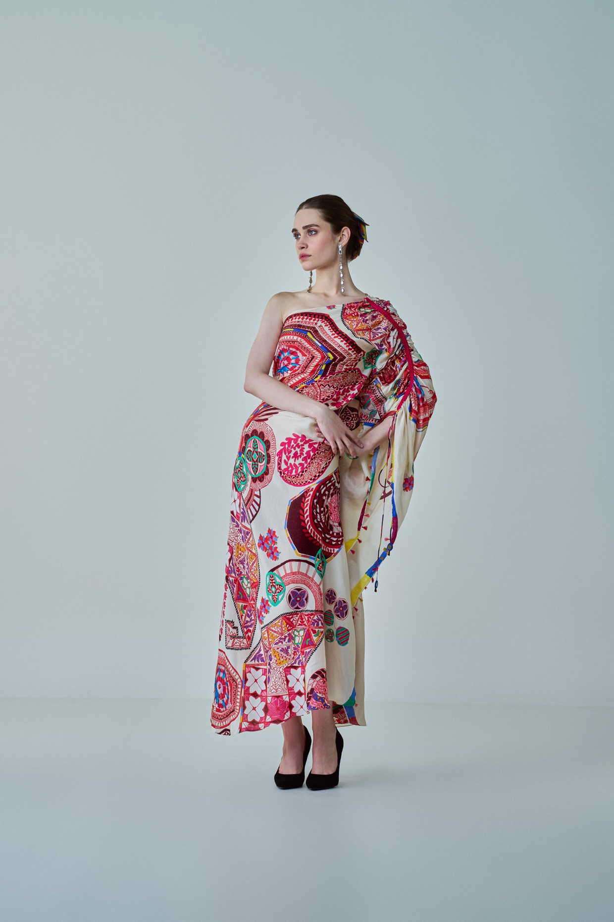 A model showcasing Isla Kaftan Asymmetric One Shoulder Kaftan by Saaksha And Kinni from Saaksha And Kinni's collection